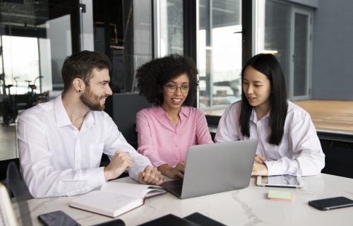 colleagues-working-together-laptop-documents (1)