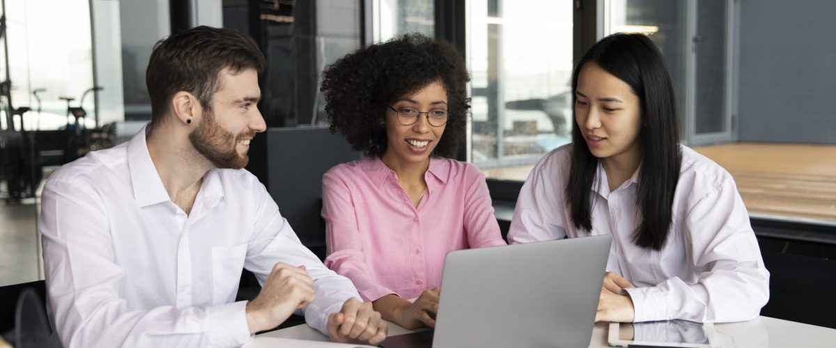 colleagues-working-together-laptop-documents (1)
