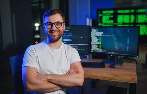 IT technician person with technology for typing code, future and data analytics.