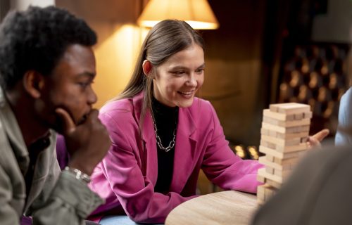 people-playing-wooden-tower-game
