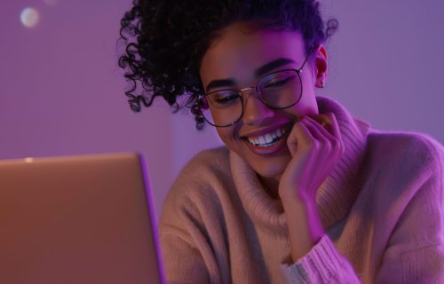 woman-is-using-laptop-with-purple-light-her